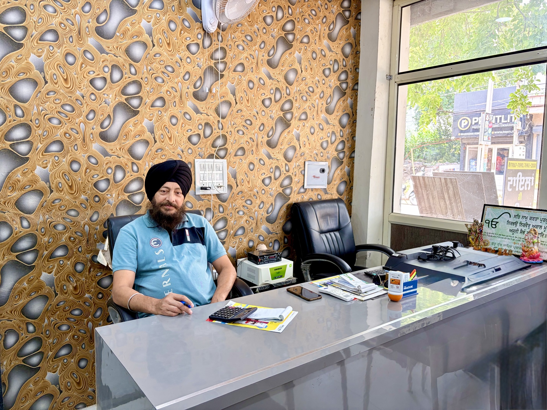 Ravinder Bir Singh at The Tile Network showroom desk