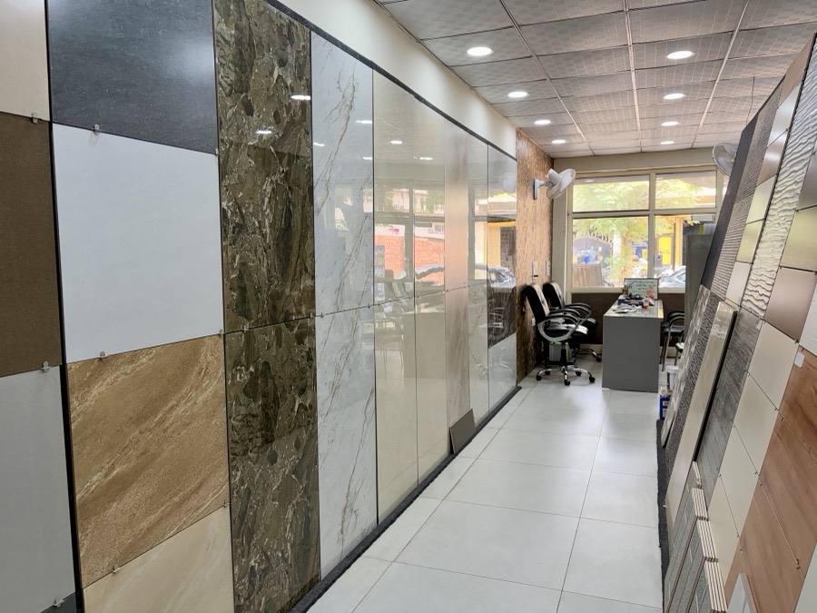 Showroom aisle with marble tile wall